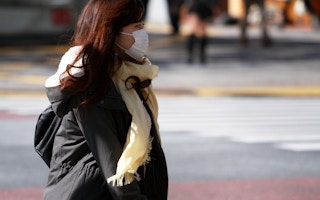 woman walking in shibuya japan