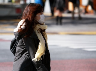 woman walking in shibuya japan