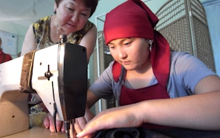 A student at a vocational school in Osh, Kyrgyzstan practices her sewing