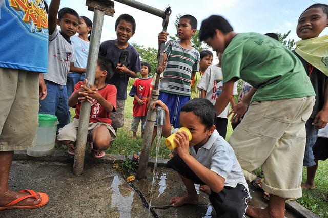 children drink water from tap