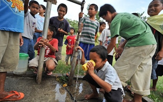 children drink water from tap
