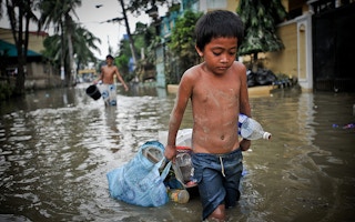 boy in flooded streets