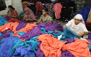 Women sort and check the finished products in the manufacturing plant of the Wool Tex Sweaters Limited in Shewrapara, Dhaka, Bangladesh