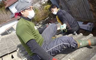 residents volunteer to clean up after fukushima tsunami and nuclear disaster