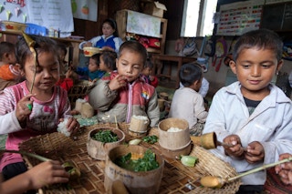 Children in Laos eating traditional foods