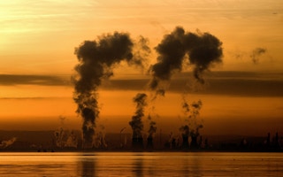 A sunset behind an oil refinery in Scotland