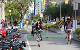 Cyclists on a busy bicycle lane in Vancouver, Canada