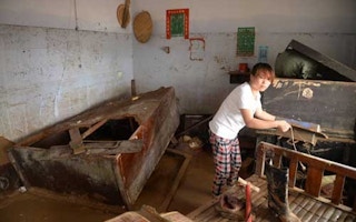 flood-stricken villager in China