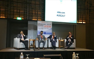 Subrata Barman (far left) of International Finance Corporation fields a heated question from the audience about the criteria for awarding loans at Unlocking Solar Capital Asia. Image: Eco-Business