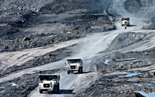 trucks in a coal mine in Indonesia