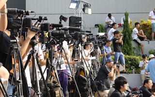 Hong Kong media waiting for a story