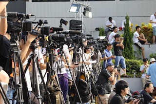 Hong Kong media waiting for a story