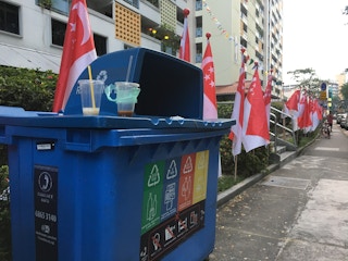 A blue recycling bin in the district of Tiong Bahru, Singapore. The city-state's recycling rate has been stagnant since 2012.  Image: Eco-Business