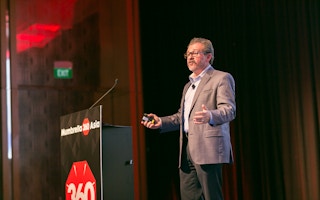 Lou Hoffman, founder of PR firm The Hoffman Agency, talking at the Mumbrella Asia 360 conference in Singapore: "Dullness comes from a combination of the lexicon of your company and corporate speak." Image: Mumbrella