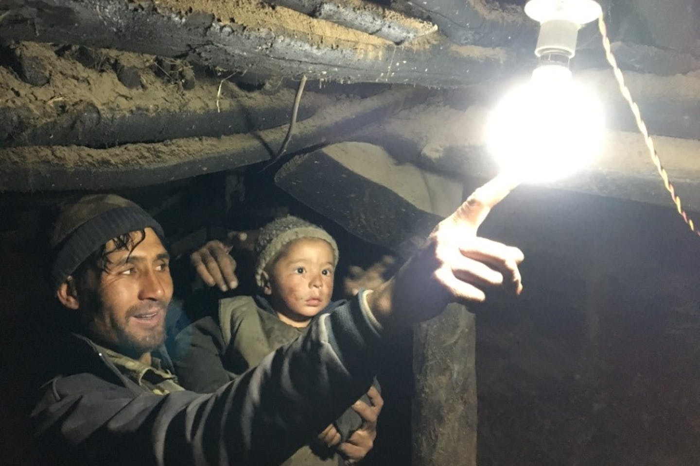 father shows light to son