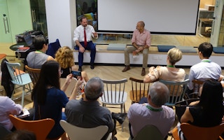 Peter White and Teymoor Nabili debate what the UN's Sustainable Development Goals mean for business at SDG Co in Singapore. Image: Eco-Business
