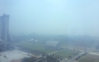 The Singapore skyline during the haze of 2015. About one third of the fires are believed to have occured in APP's concessions in South Sumatra. image: Eco-Business