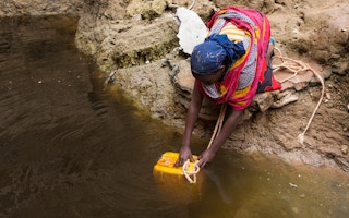Woman drawing water in Ethiopia