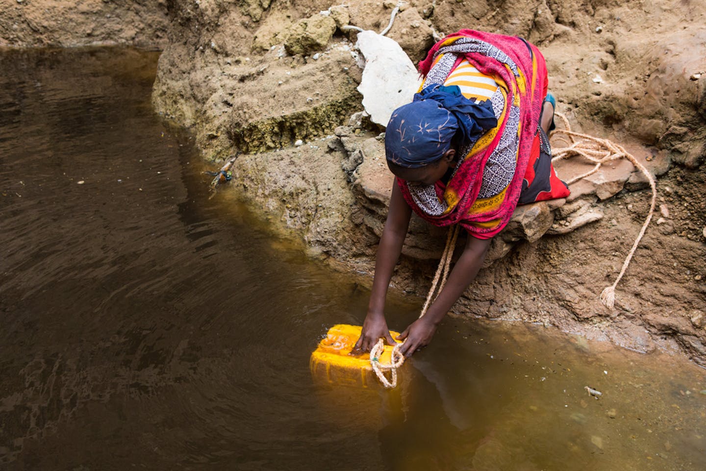 Woman drawing water in Ethiopia