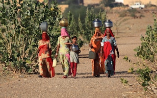women carrying water india