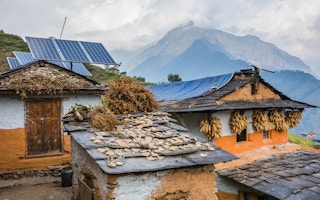traditional nepali houses with solar panel roofs