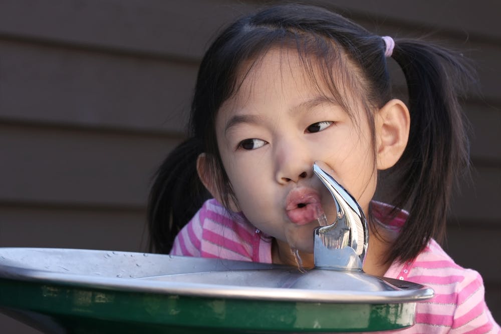 child drinking water