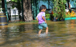 boy in floods thailand