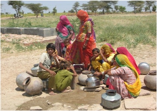 women fetch water from India